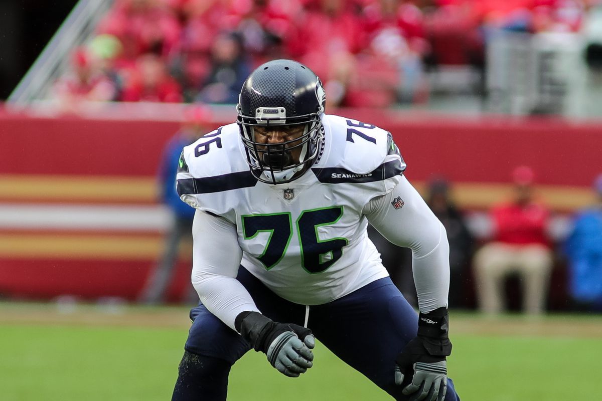 Should the Bears sign a veteran offensive tackle to compete with Teven Jenkins and Larry Borom?